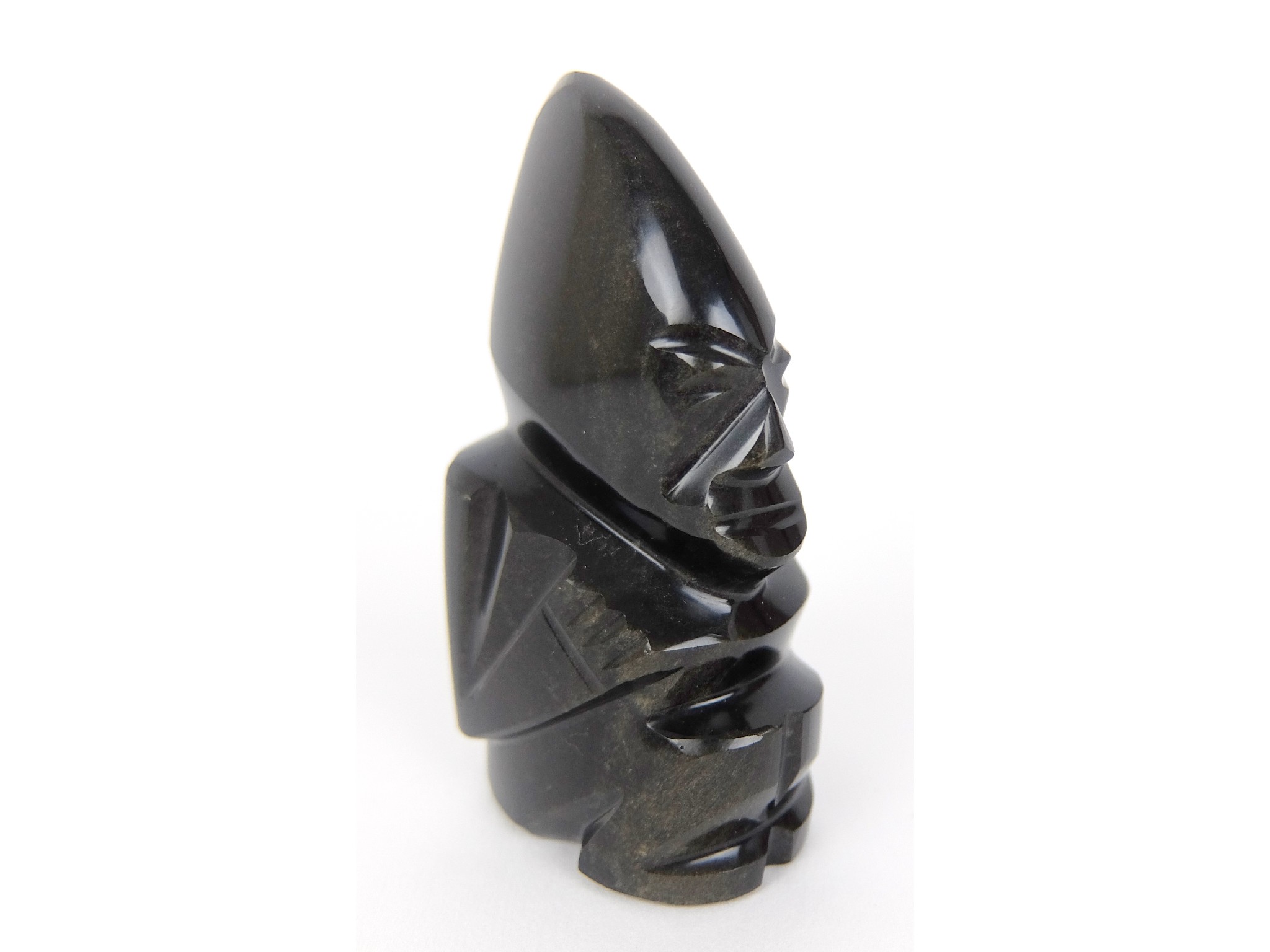 Appraisal: A carved Obsidian figurepossibly of a South Sea Island God