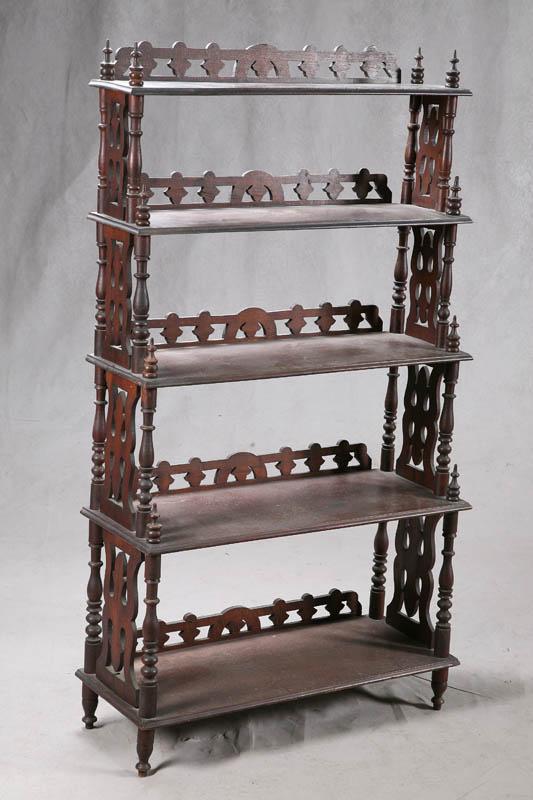 Appraisal: ETAGERE In walnut with five graduated shelves with turned posts