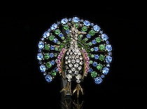 Appraisal: A Czechoslovakian Peacock Brooch Brass frame marked CZECHO studded with