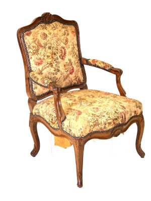 Appraisal: A Louis XVI style walnut fauteuil the acanthus carved shaped