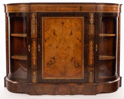 Appraisal: A Victorian figured walnut gilt metal mounted credenza enclosed by