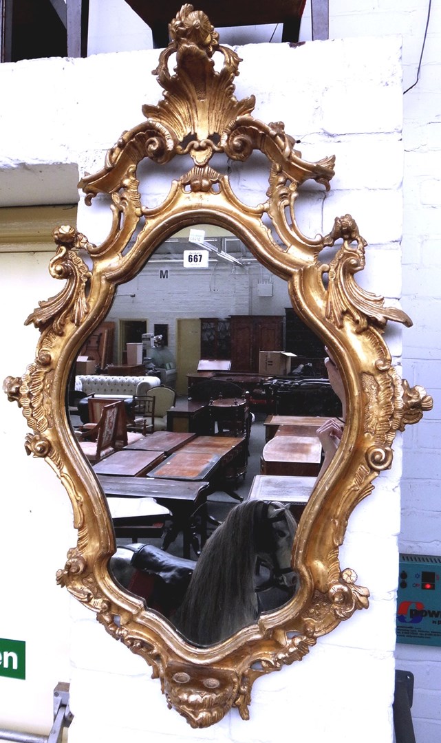 Appraisal: A th century Italian gilt frame wall mirror with shell