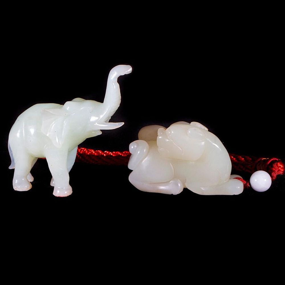 Appraisal: Two pieces of Chinese jade Two Chinese jade carvings Elephant