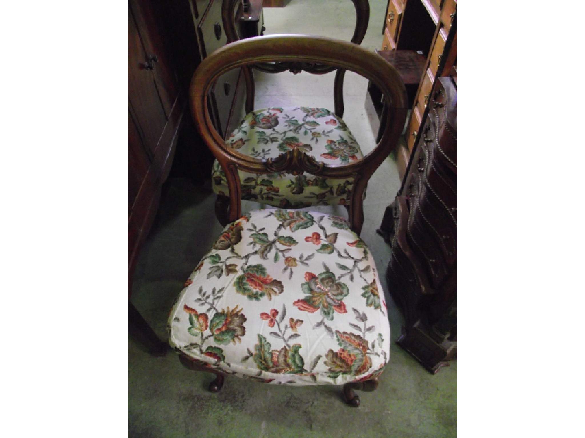 Appraisal: A pair of Victorian walnut balloonback dining chairs with carved