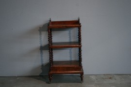 Appraisal: A Victorian walnut whatnot with three shelves on barley twist