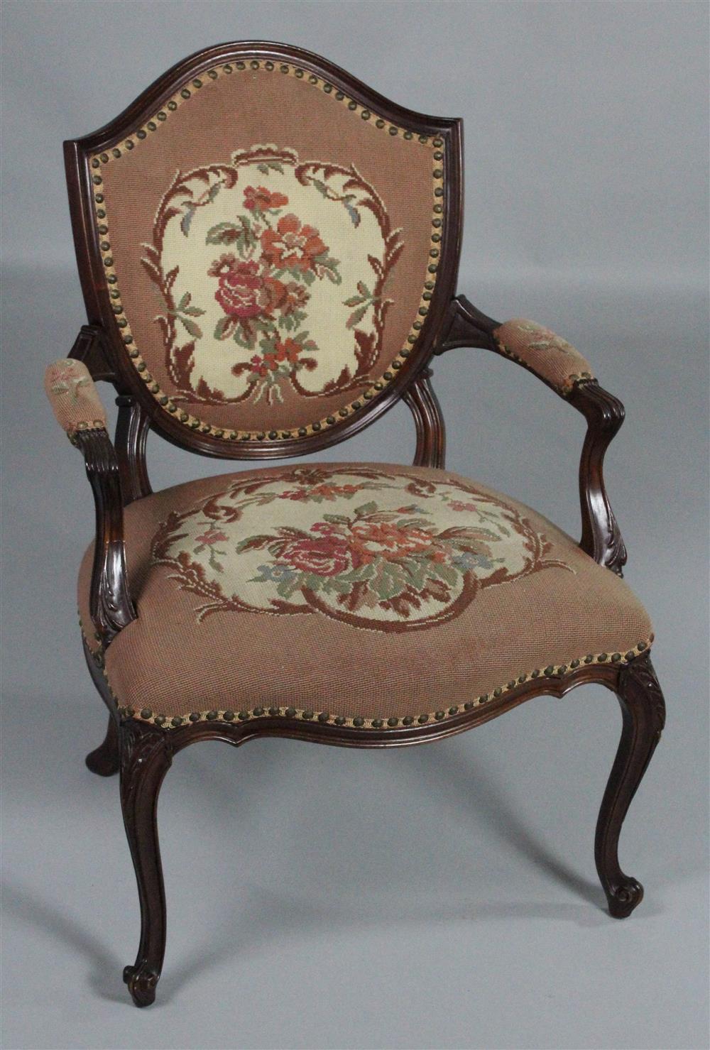 Appraisal: GEORGE III STYLE MAHOGANY AND NEEDLEPOINT UPHOLSTERED SHIELD BACK ARM