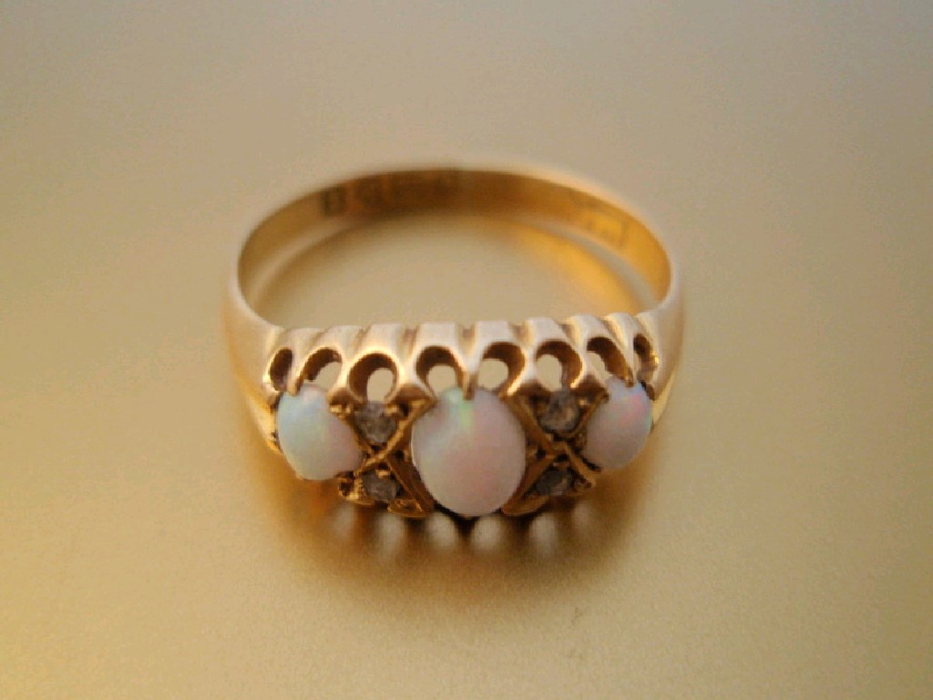 Appraisal: An ct gold dress ring set with three small opals