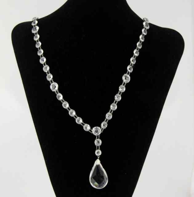 Appraisal: A glass necklace with pear shaped faceted drop