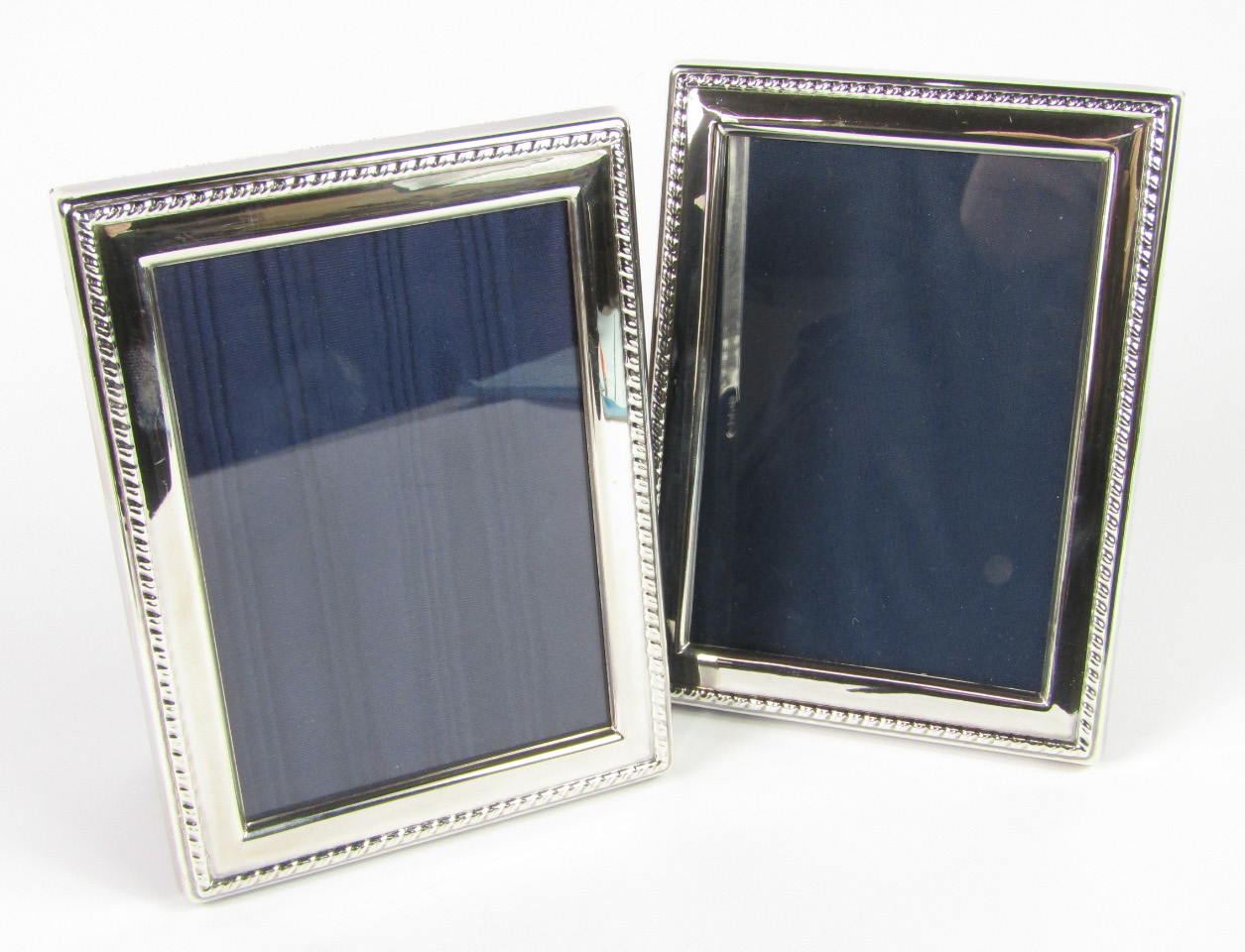 Appraisal: A pair of silver strut photograph frames with fluted edges