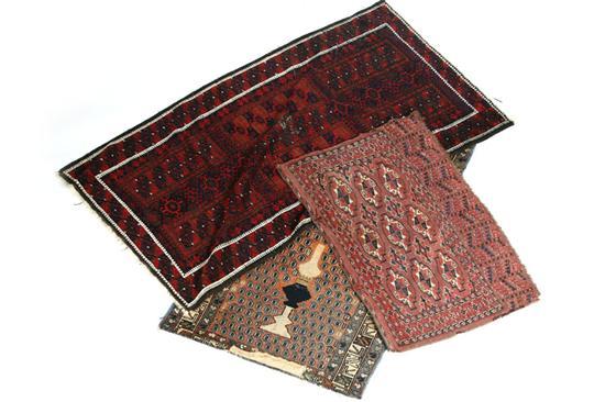 Appraisal: THREE ORIENTAL RUGS Turkoman in shades of rust and brown