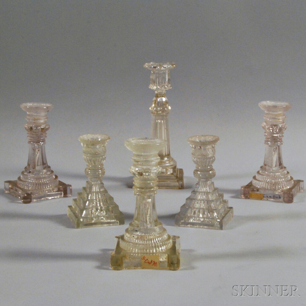 Appraisal: Six Colorless Pressed Glass Candlesticks two pairs one with reeded