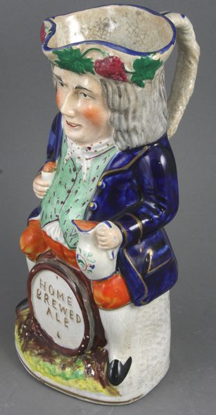 Appraisal: Early th Century English Staffordshire Toby jug h Minor chips