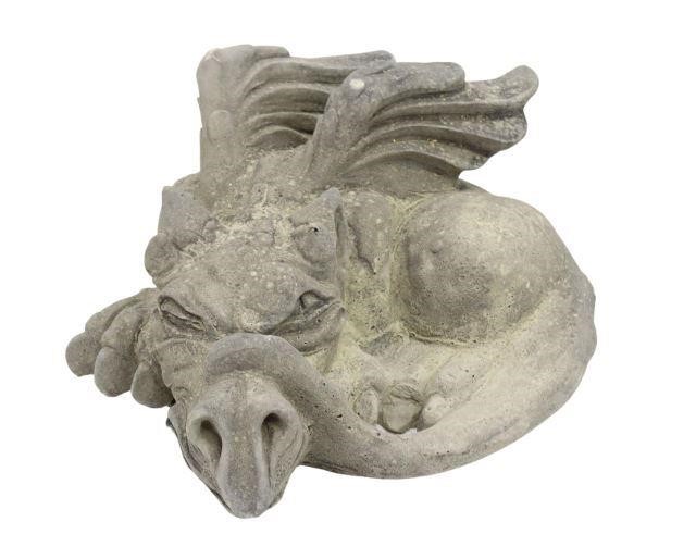 Appraisal: Cast stone garden statuary depicting coiled recumbent dragon figure having