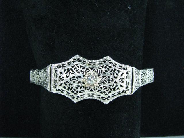 Appraisal: K White gold diamond filigree bracelet with ct diamond