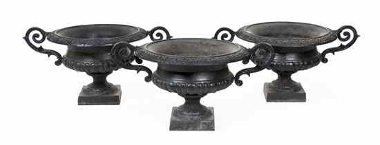 Appraisal: A Set of Three Cast Iron Urns of circular form