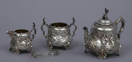 Appraisal: VICTORIAN SILVER REPOUSS THREE-PIECE TEA SET Marks for I F