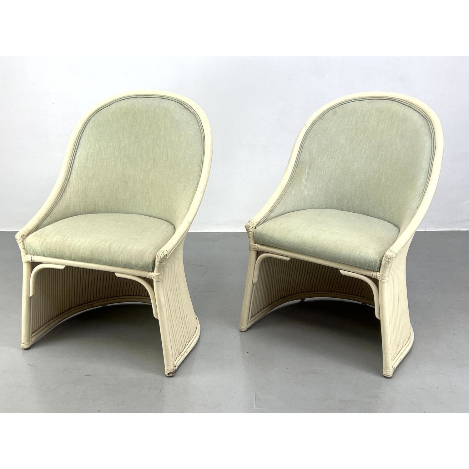 Appraisal: Pair of Cream Rattan Chairs Upholstered seat and back Rest