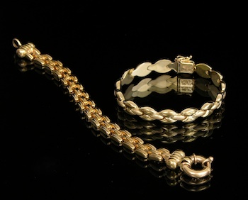 Appraisal: Two k Gold Bracelets Containing a ribbed link bracelet with