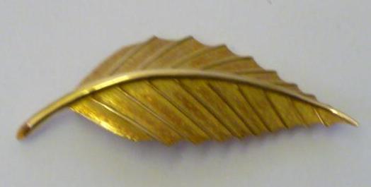 Appraisal: A BOUCHERON CT GOLD BROOCH modelled as a single leaf