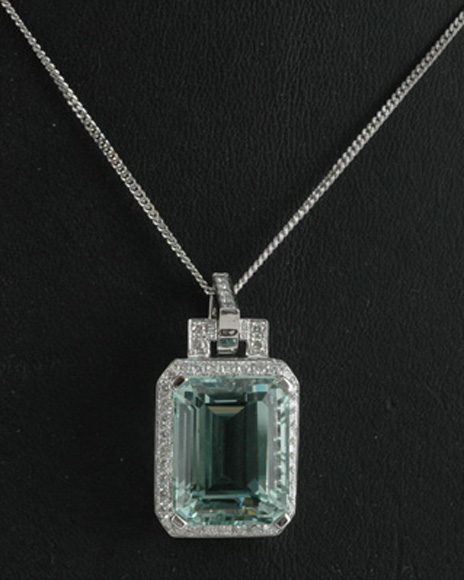 Appraisal: An aquamarine and diamond pendant The emerald cut aquamarine weighing