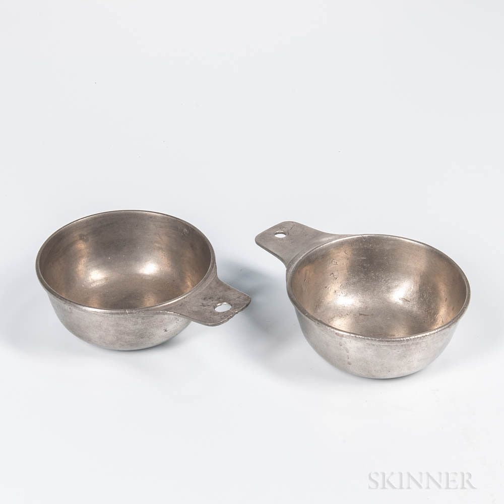 Appraisal: Two Pewter Porringers Two Pewter Porringers th century with tab