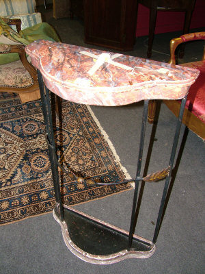 Appraisal: A simulated marble topped metal umbrella stand together with an