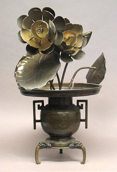 Appraisal: A two-section bronze usabata The three-legged container now filled with