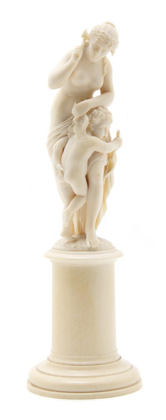 Appraisal: French Carved Ivory Figural Group depicting Venus punishing Cupid raised