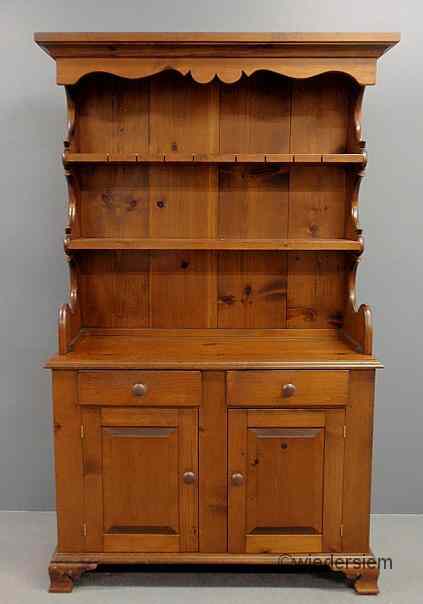 Appraisal: Pine two-piece open shelf cupboard th c with a scalloped