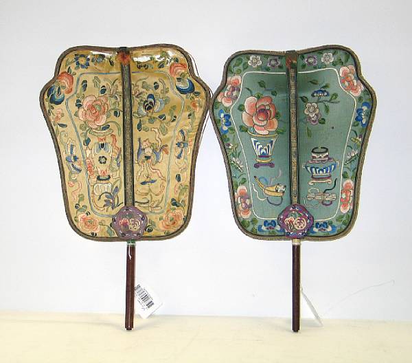 Appraisal: Two embroidered silk fans Both with incised wood handles decorated