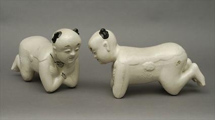 Appraisal: Pair of Modern Chinese Glazed Pottery Figural Pillows Each in