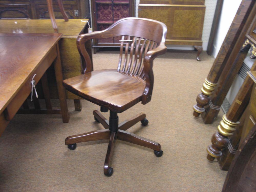 Appraisal: A modern dark stained beech office armchair with slatted back