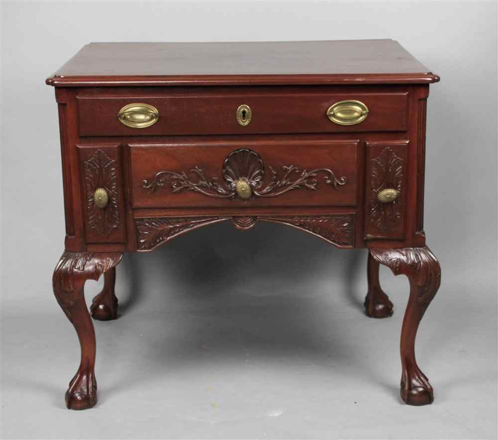 Appraisal: CHIPPENDALE STYLE CARVED MAHOGANY LOWBOY WITH SHELL DESIGN the molded