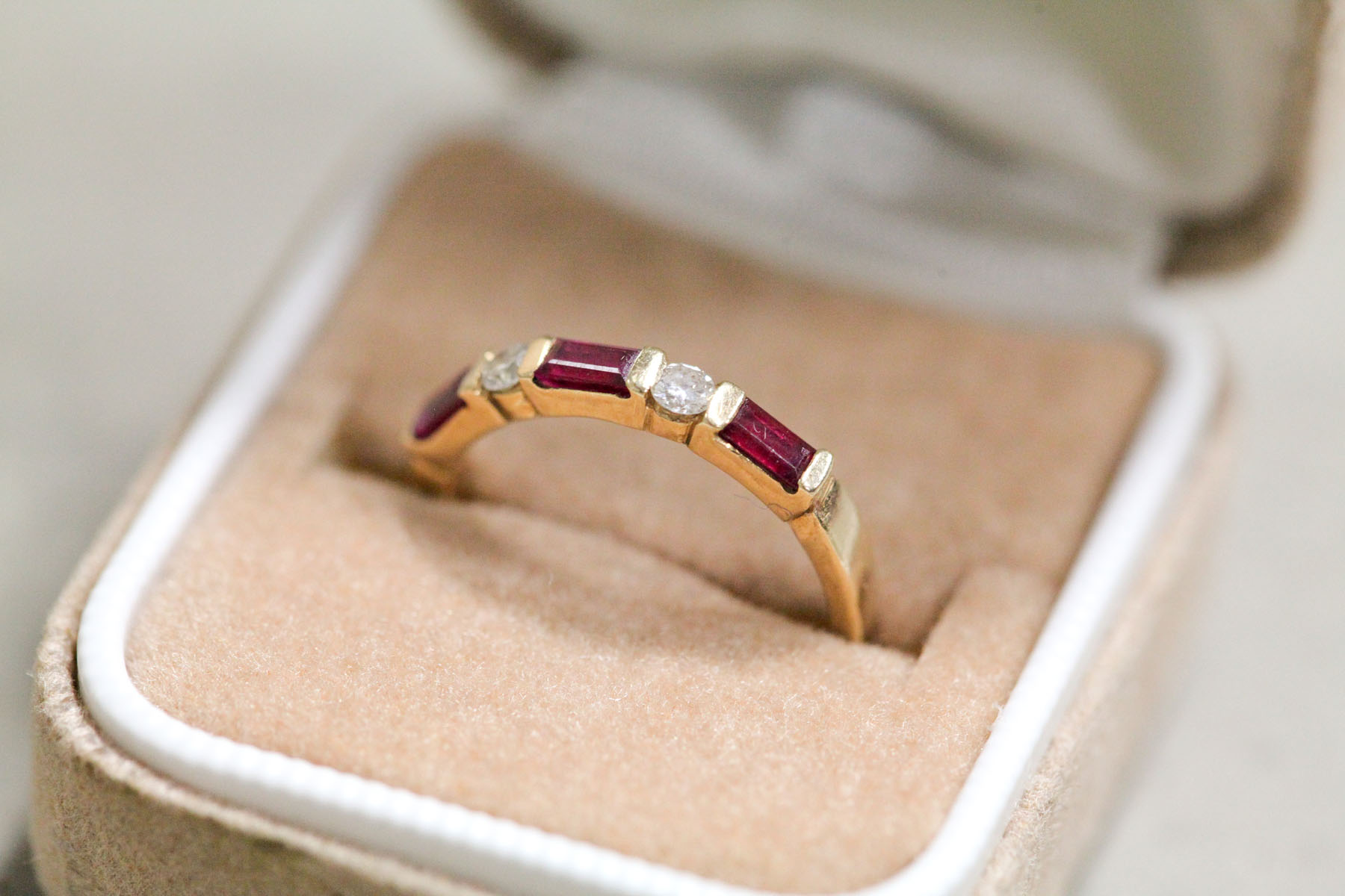 Appraisal: DIAMOND AND RUBY BAND RING Late th century Set with