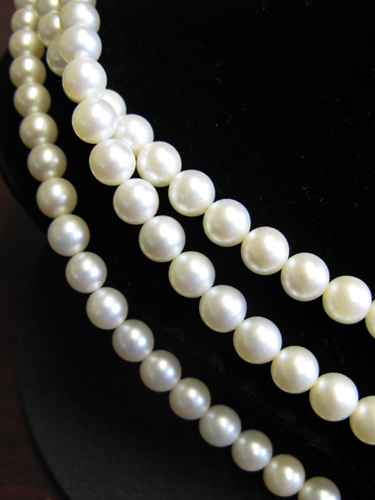 Appraisal: TRIPLE-STRAND PEARL NECKLACE with three separate strands of well matched