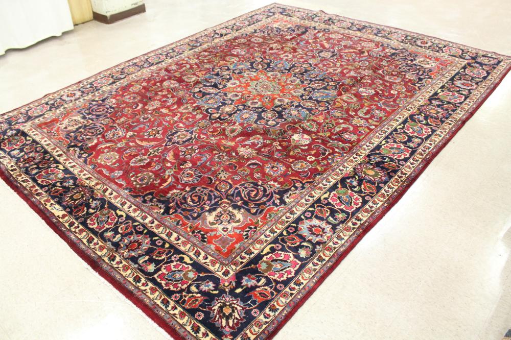 Appraisal: HAND KNOTTED PERSIAN CARPET floral and central floral medallion design