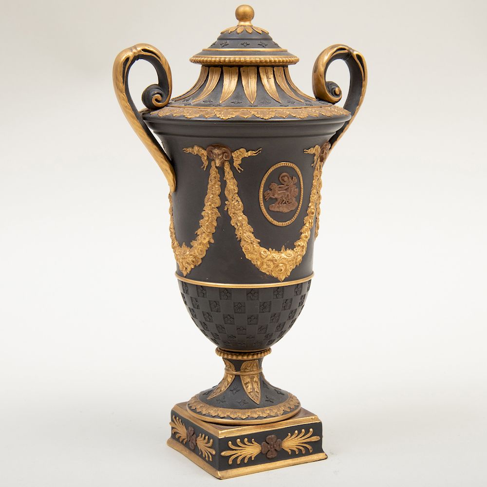 Appraisal: Wedgwood Black Basalt Bronze and Gilt-Decorated Vase and Cover Impressed