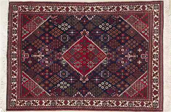 Appraisal: A Northwest Persian Wool Rug having a geometric center medallion