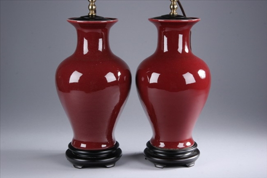 Appraisal: PAIR CHINESE COPPER RED PORCELAIN BALUSTER VASES Electrified - in