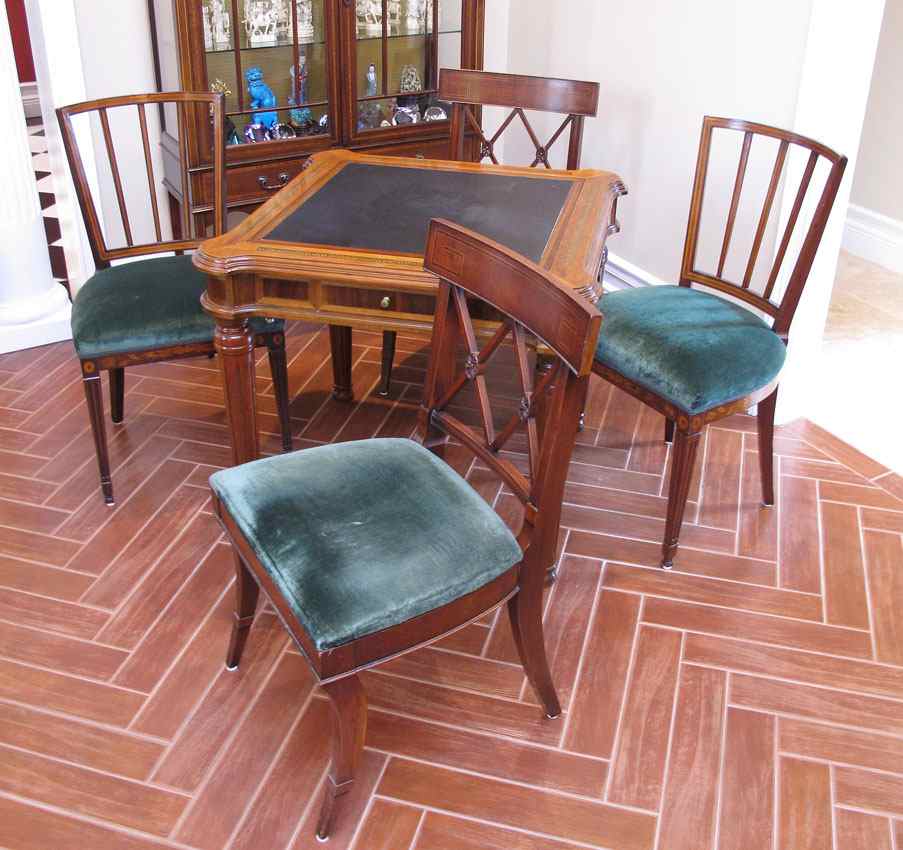 Appraisal: VICTORIAN BANDED AND INLAY GAME TABLE The leather top converts