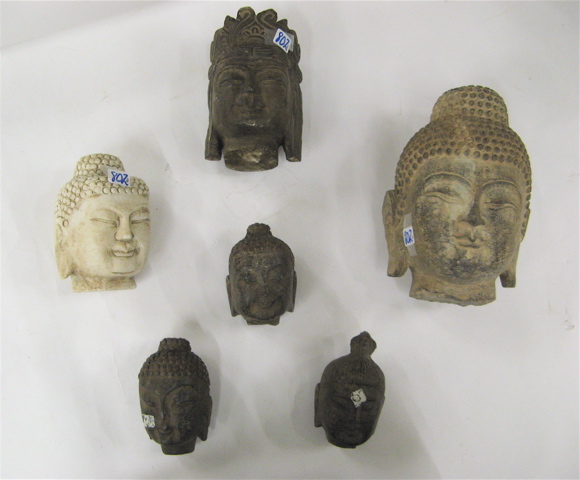 Appraisal: SIX STONE SCULPTED BUDDHA HEADS five granite and one marble