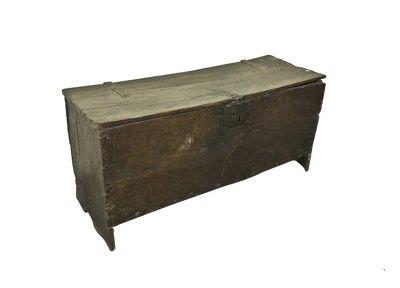 Appraisal: A th Century oak six-plank chest with strap hinged lid