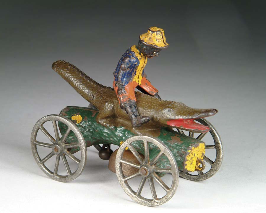 Appraisal: ALLIGATOR AND BOY BELL TOY Manufactured by N N Hill