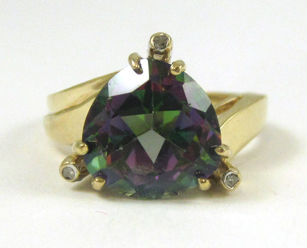 Appraisal: MYSTIC TOPAZ AND DIAMOND RING The k yellow gold ring