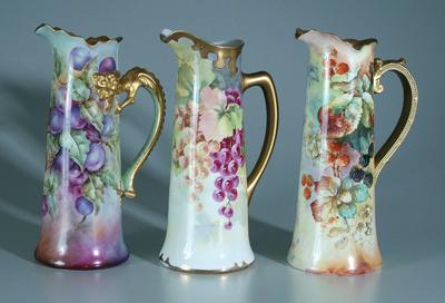 Appraisal: Three hand painted porcelain pitchers one with plums hand painted