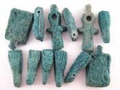 Appraisal: A bag containing twelve Egyptian faience amulet beads