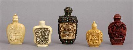 Appraisal: THREE CHINESE CARVED IVORY SNUFF BOTTLES AND STOPPERS A CINNEBAR