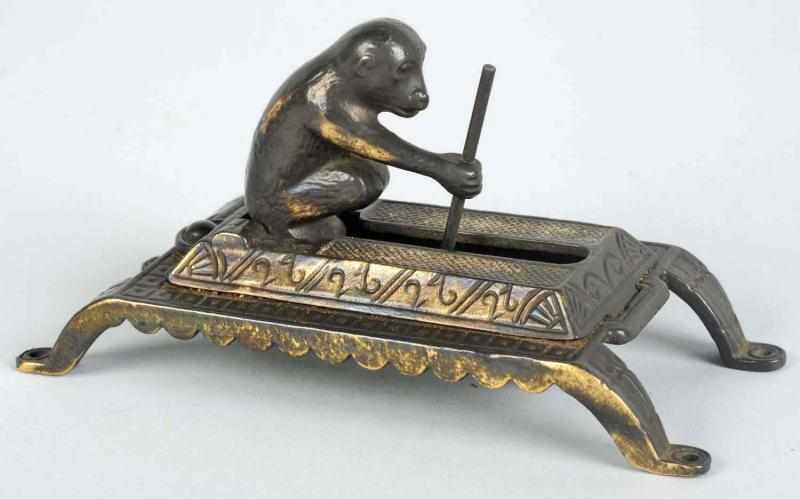 Appraisal: Brass Mechanical Monkey Match Dispenser Nice detail Working Condition Excellent