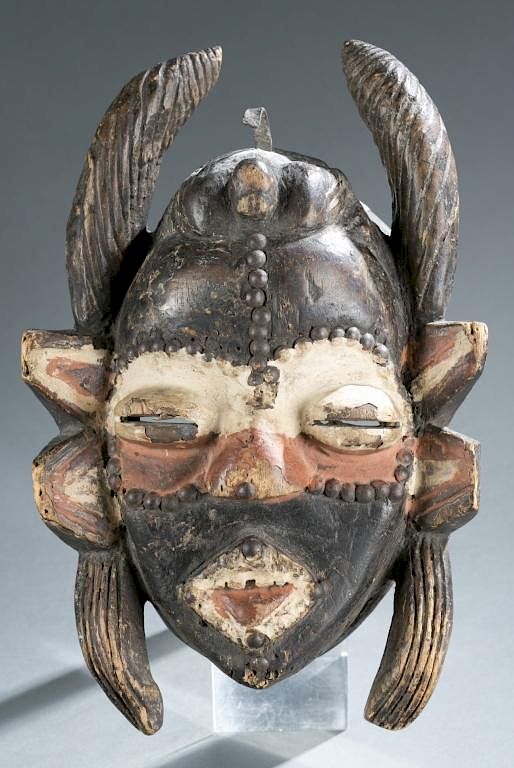 Appraisal: Horned face mask A horned face mask Liberia Dan style