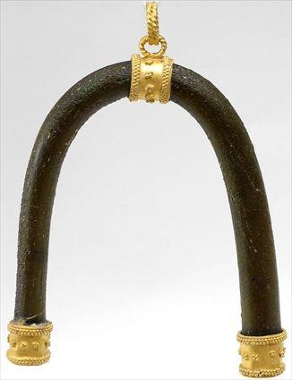 Appraisal: Glass Horseshoe-Form Pendant with Gold Fittings